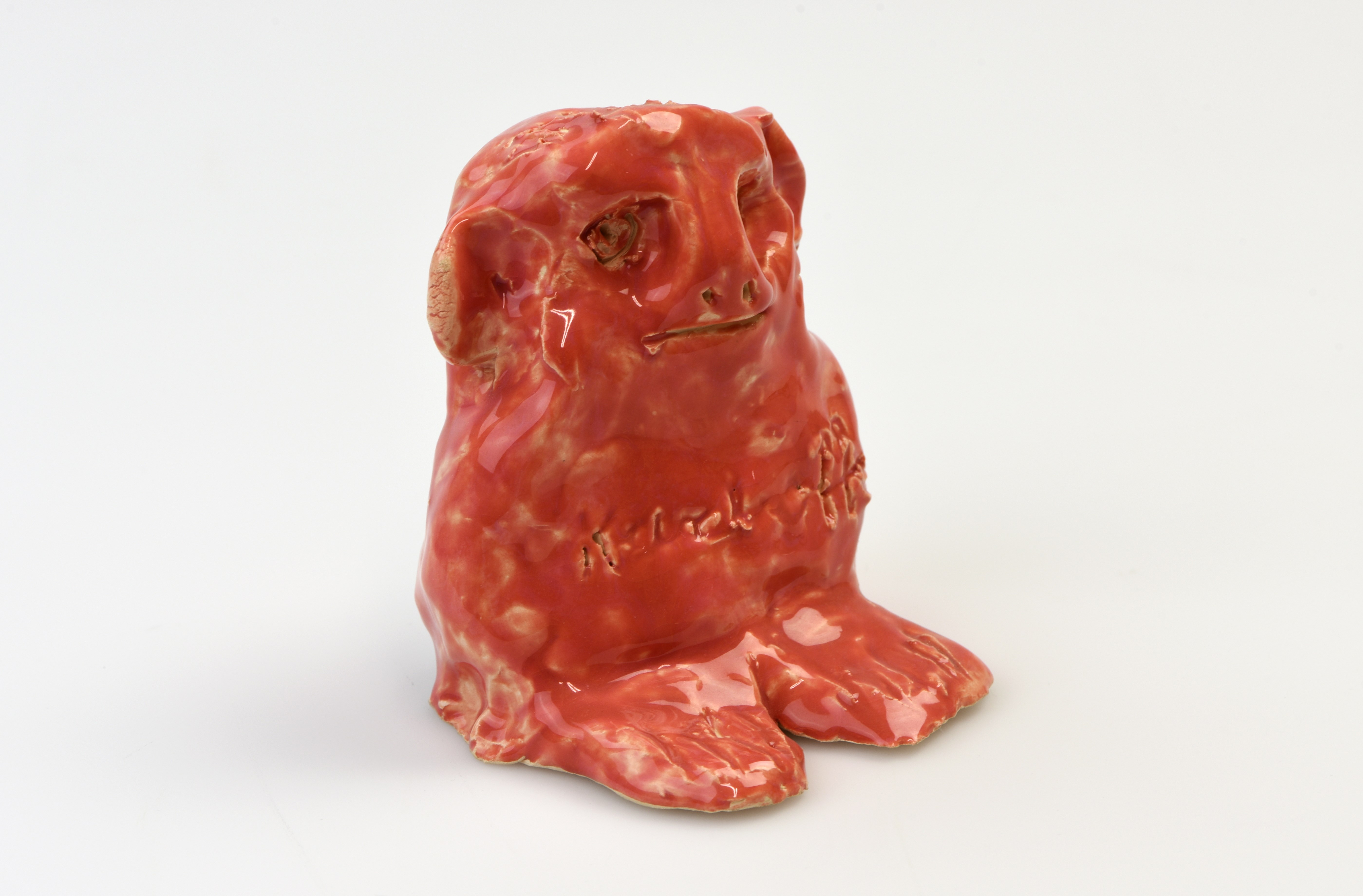 Glserad keramikfigur, röd